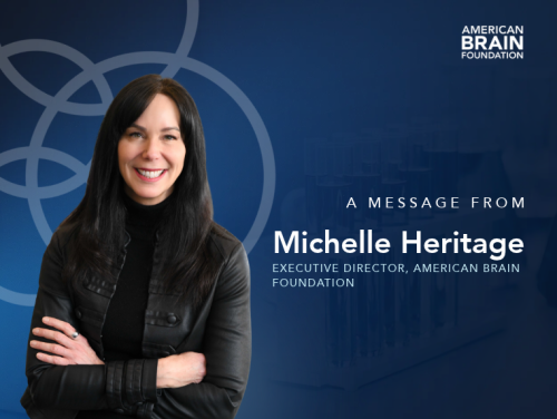 A photograph of Michelle Heritage against a blue background. Text reads "A message from Michelle Heritage, American Brain Foundation Executive Director"
